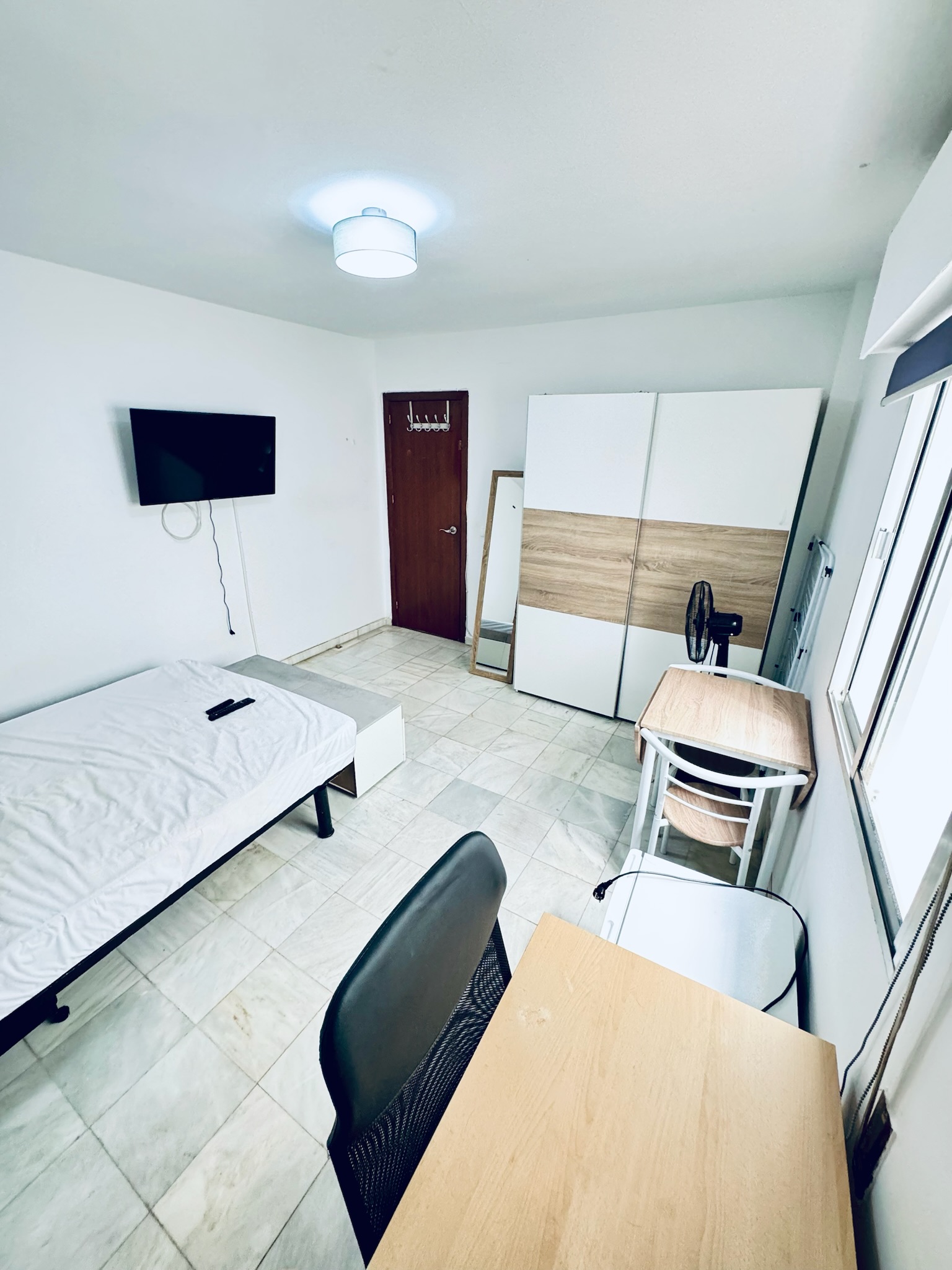 Room H32 · full view with bed, wardrobe, TV and study area