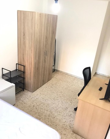 Room H44 · wardrobe and study area