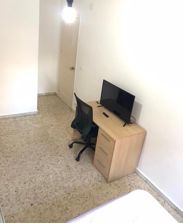Room H44 · desk, TV and entrance