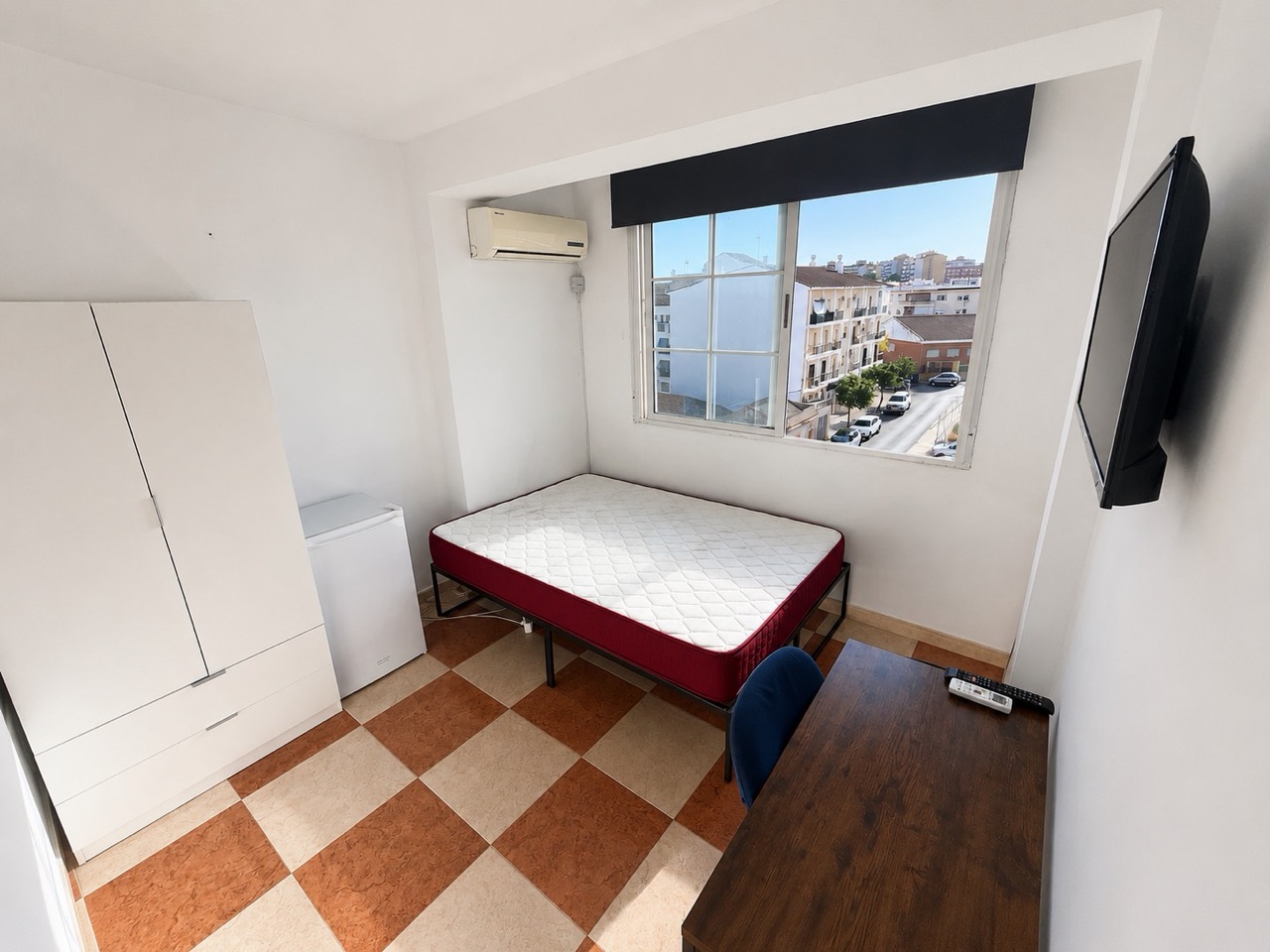 Room H61 · full view with wardrobe, mini-fridge and TV