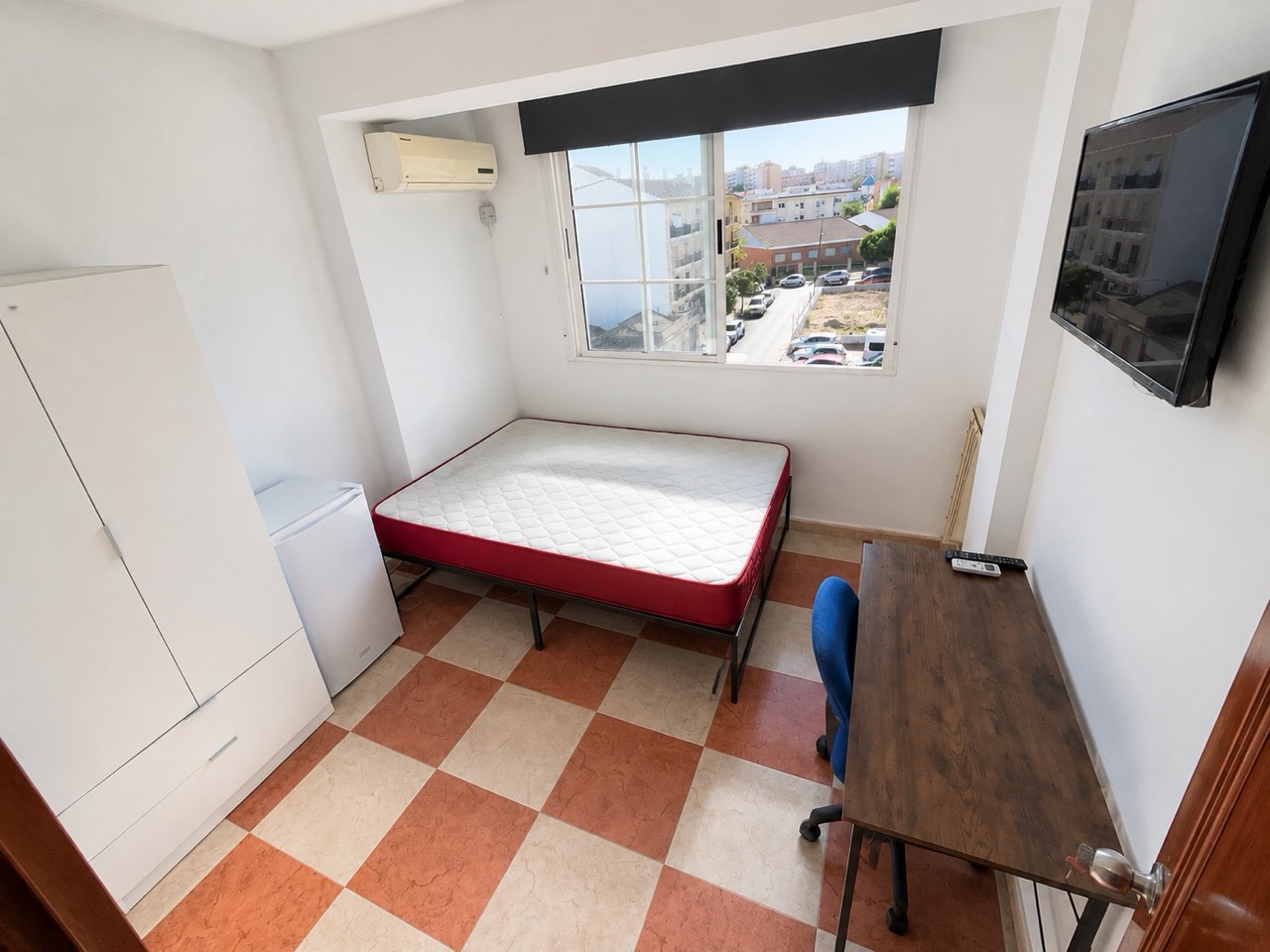 Room H61 · entrance view with desk and exterior window