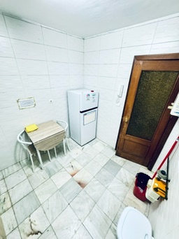 Shared kitchen · fridge, dining table and corridor access