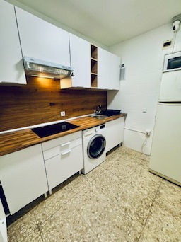 Shared kitchen · side view of the cooking area and fridge